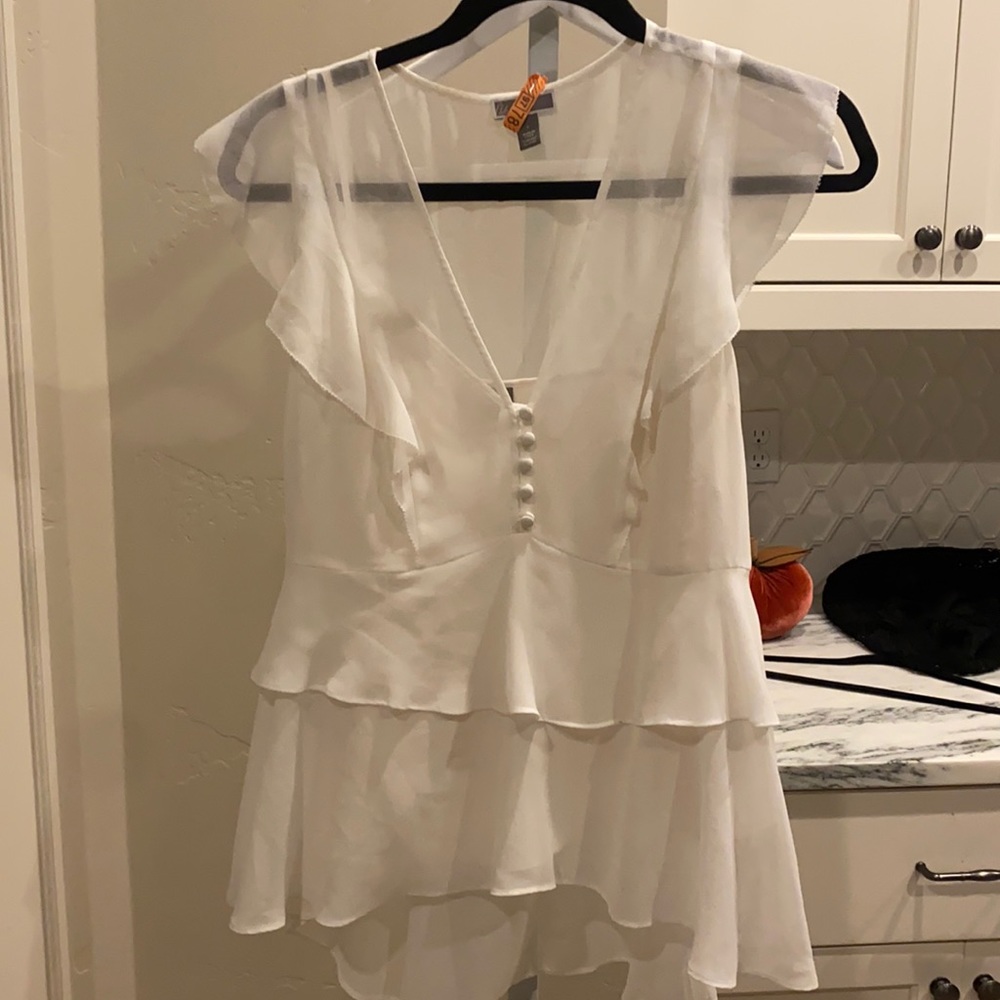 White ruffle blouse